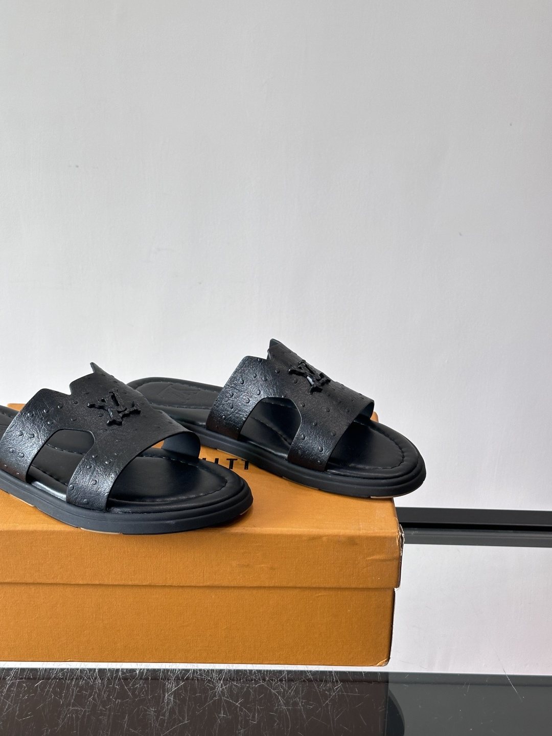 Louis Vuitton Black Embossed Slide Sandals — side
