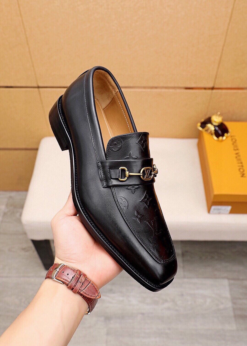 Louis Vuitton Embossed Buckle Loafers — model