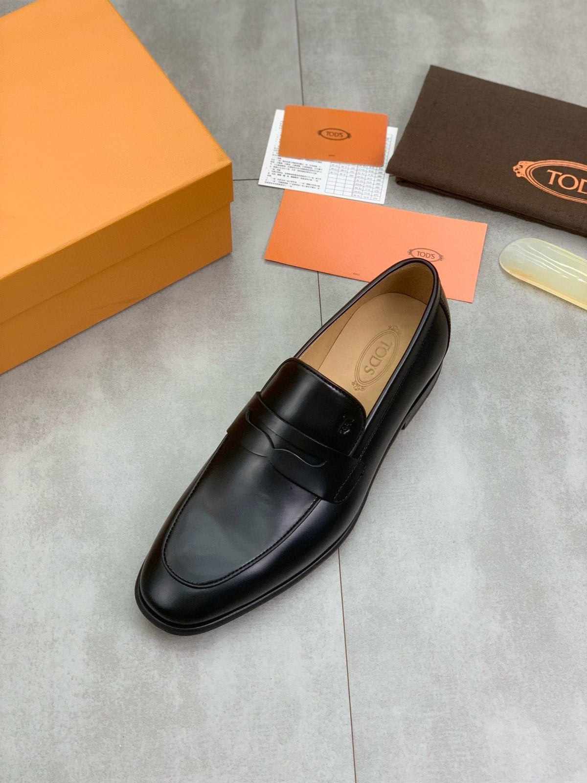 Tod's Black Penny Loafers — front